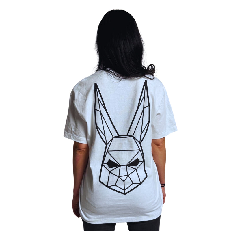 Model wearing a white t-shirt with The Magician's geometric rabbit mask on the back.