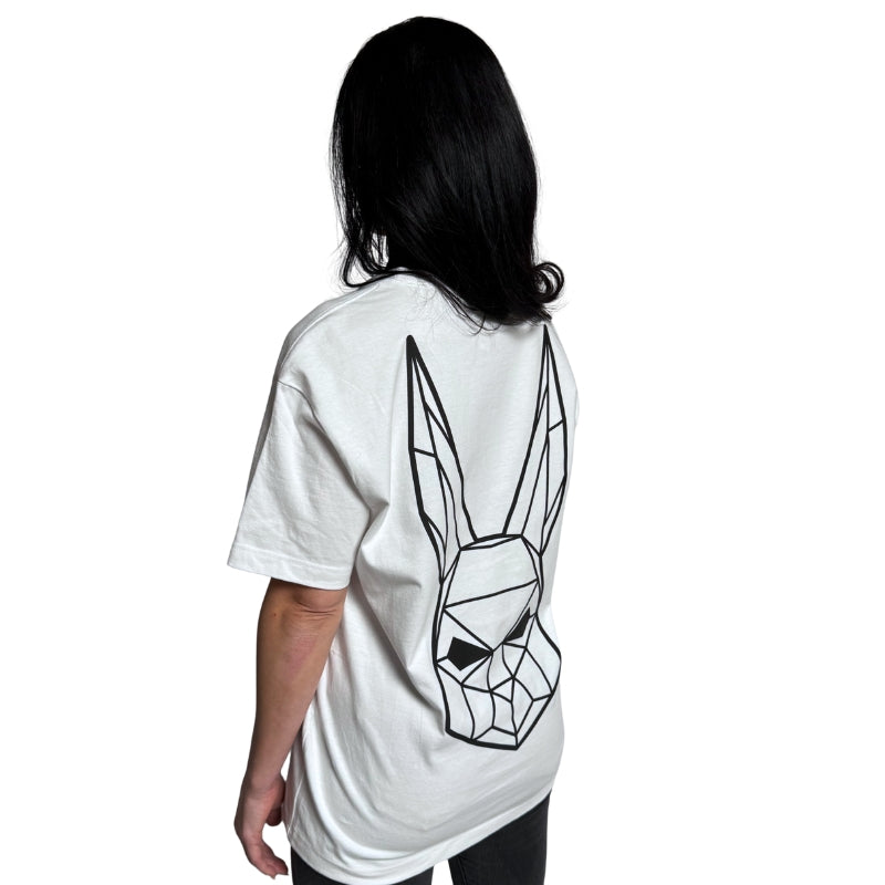Model wearing a white t-shirt with The Magician's geometric rabbit mask on the back.