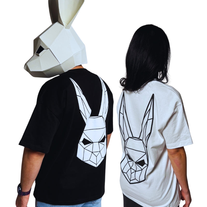 The Magician wearing a black t-shirt and the model wearing a white t shirt with The Magician's geometric rabbit mask on the back.